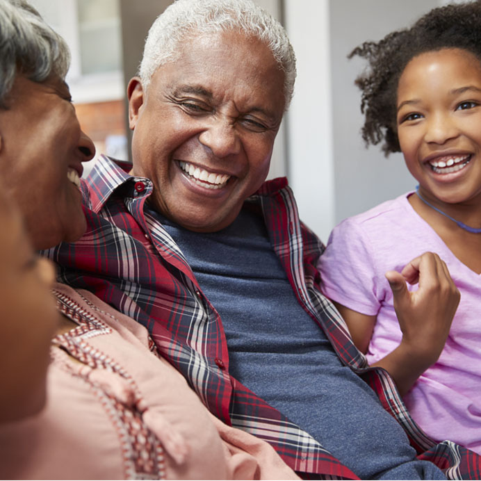 African American grandparents with grandchildren laughing