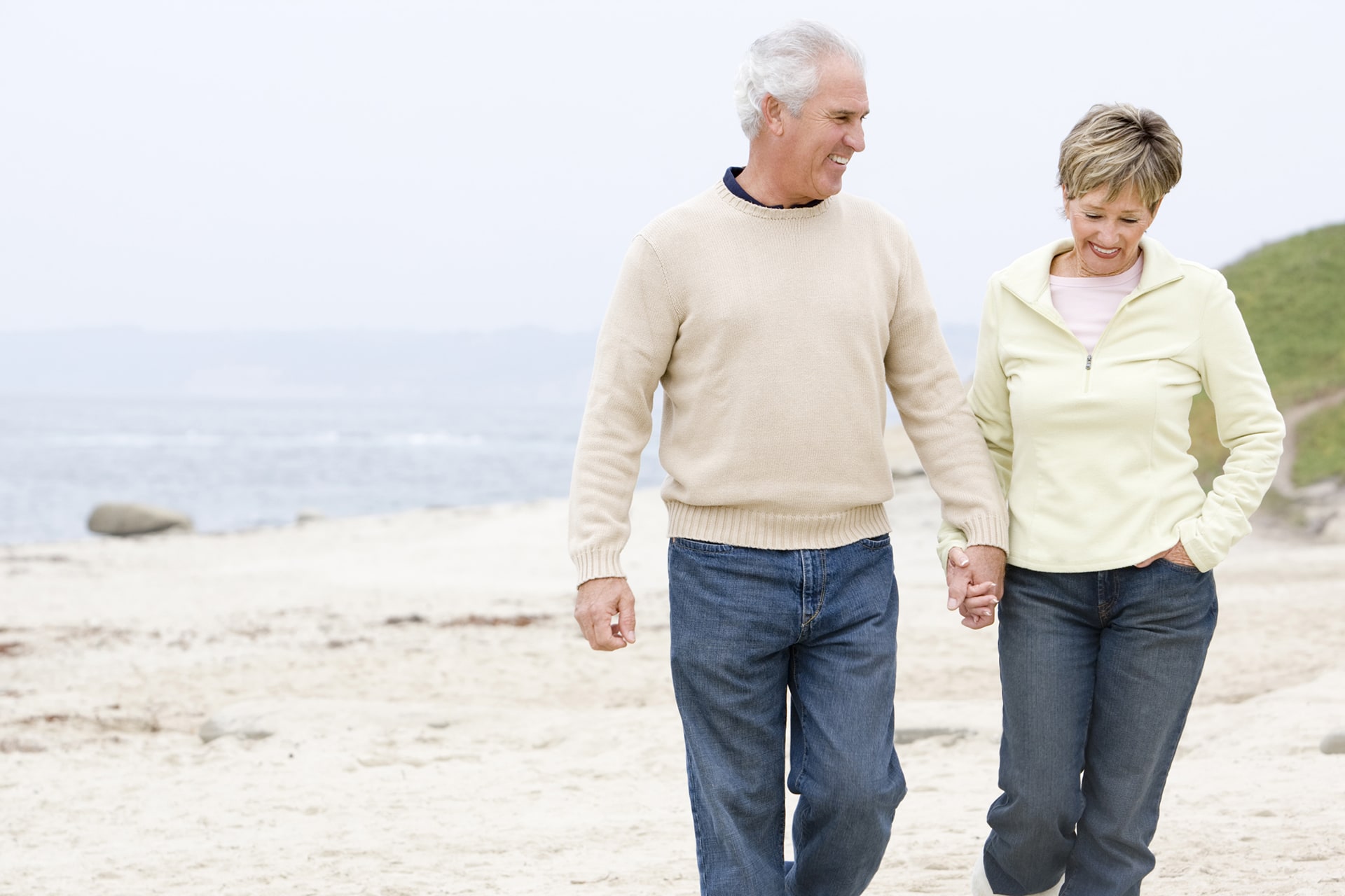 Senior Couple Walking on Beach