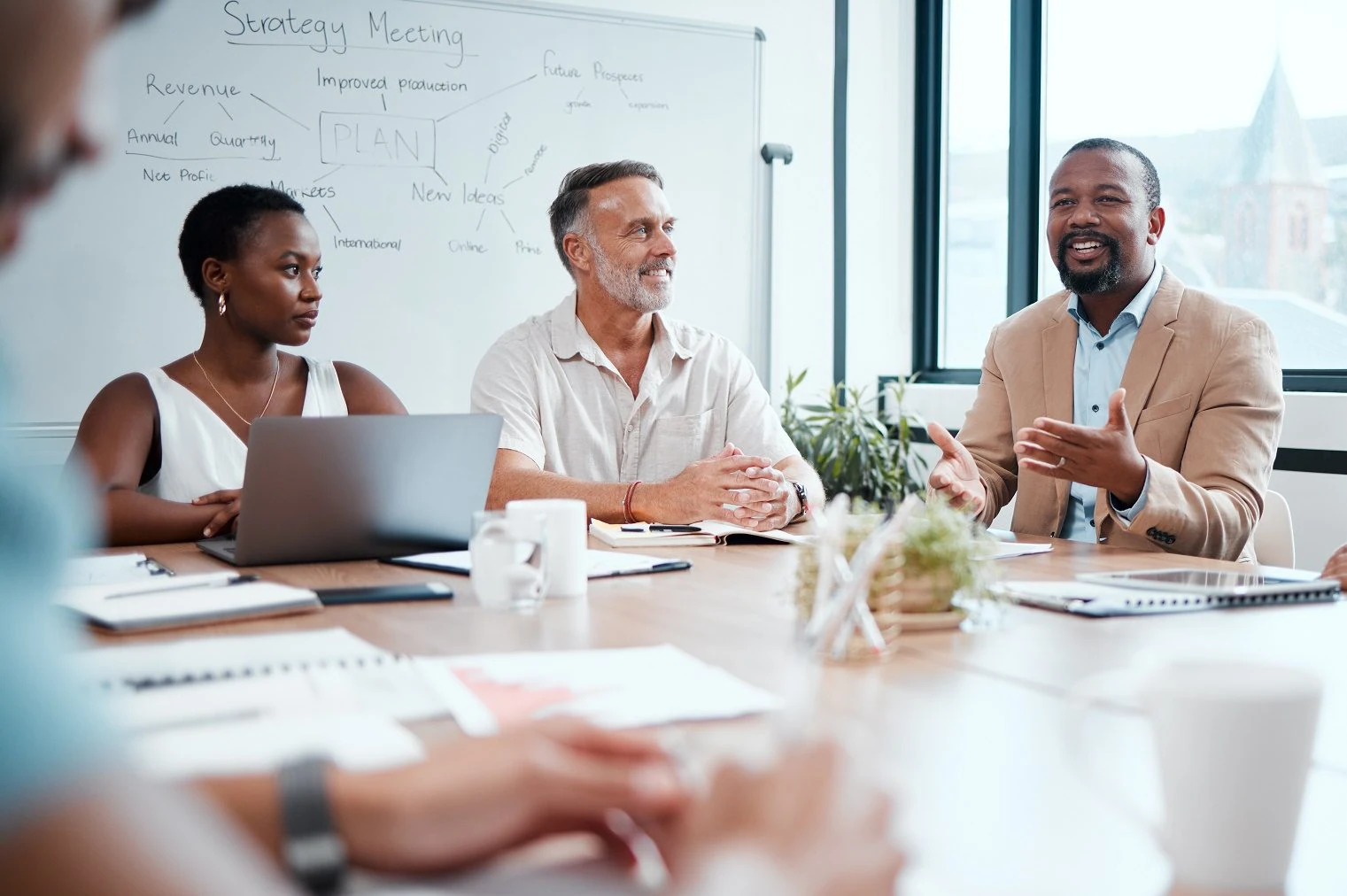 Happy business people, meeting and strategy in planning, team discussion or sharing idea at office. Group of employees in teamwork, collaboration or discussing project plan in conference at workplace