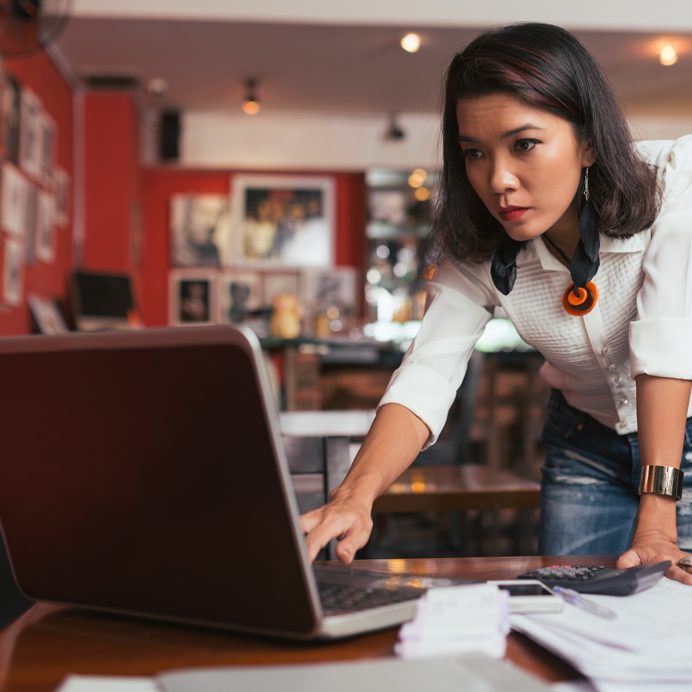 Woman doing business banking on laptop